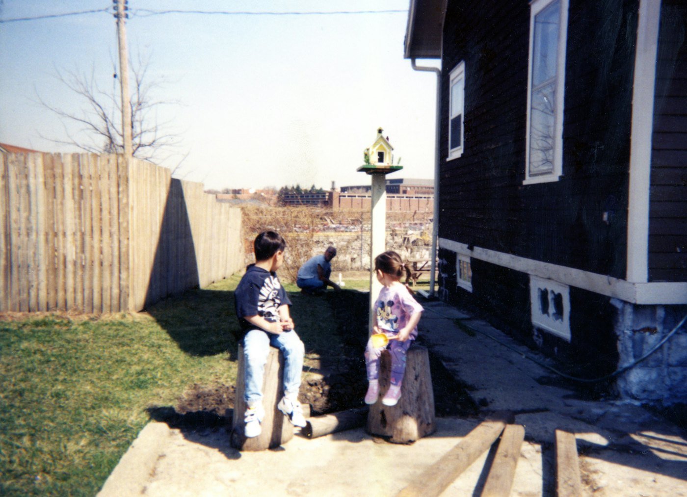 Children playing in a sunny backyard
